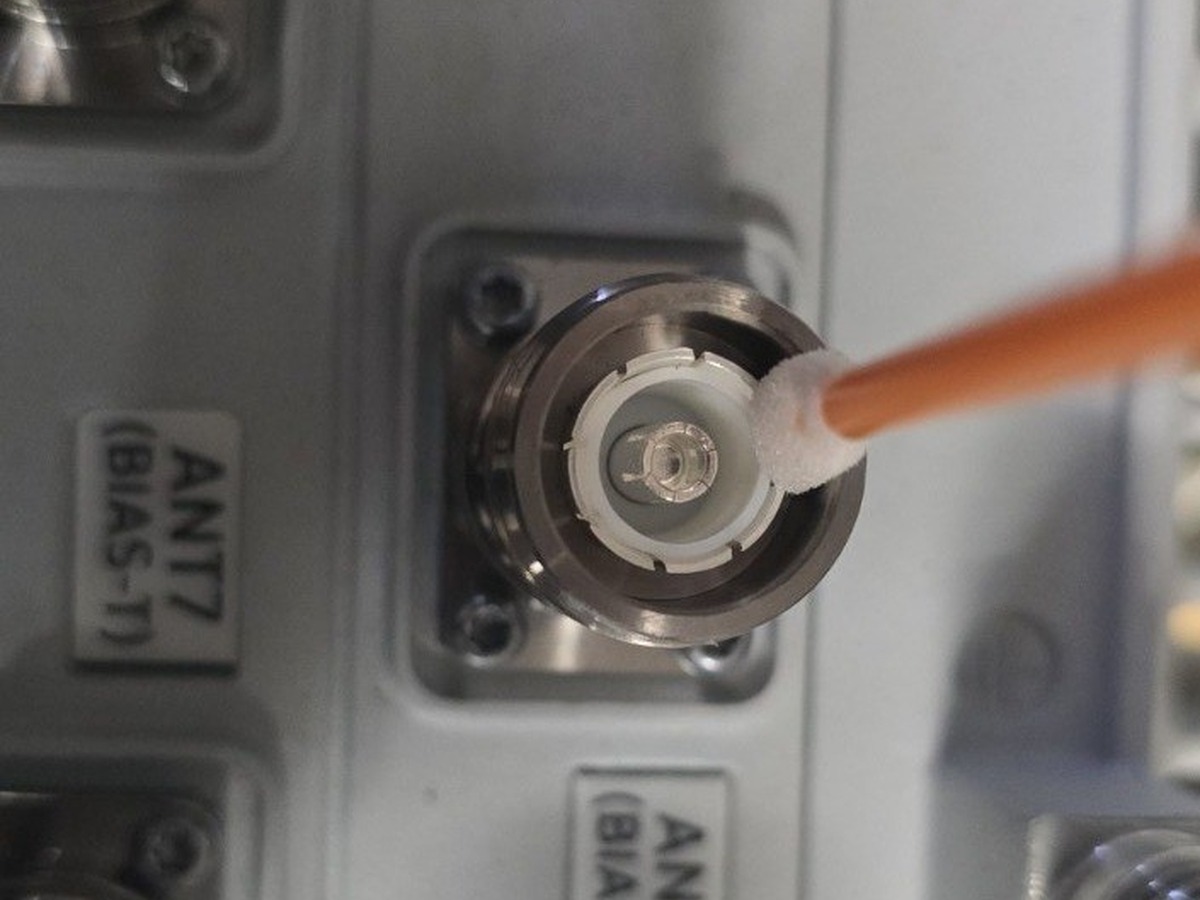 Cleaning a 4.3-10 female connector with a dry foam swab
